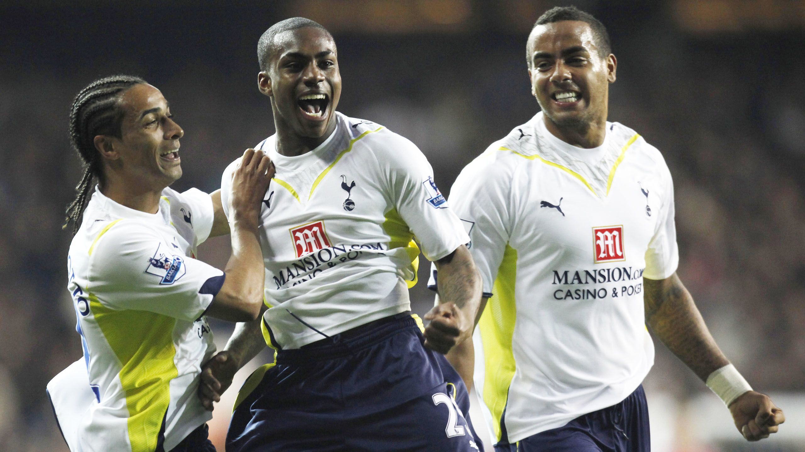 Danny celebrates with Benoit and Tom Huddlestone...