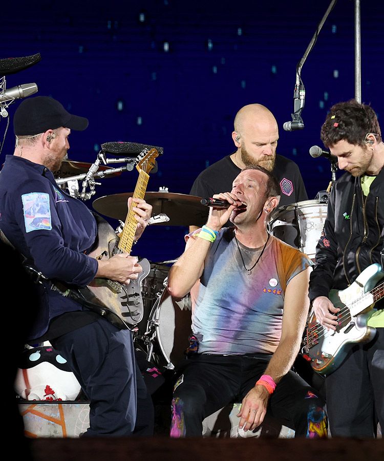 Coldplay, featuring guitarist and Spurs fan, Jonny Buckland, left, playing live in the USA...