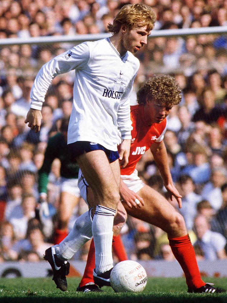 Steve takes on Arsenal defender Tommy Caton at Highbury in 1984...